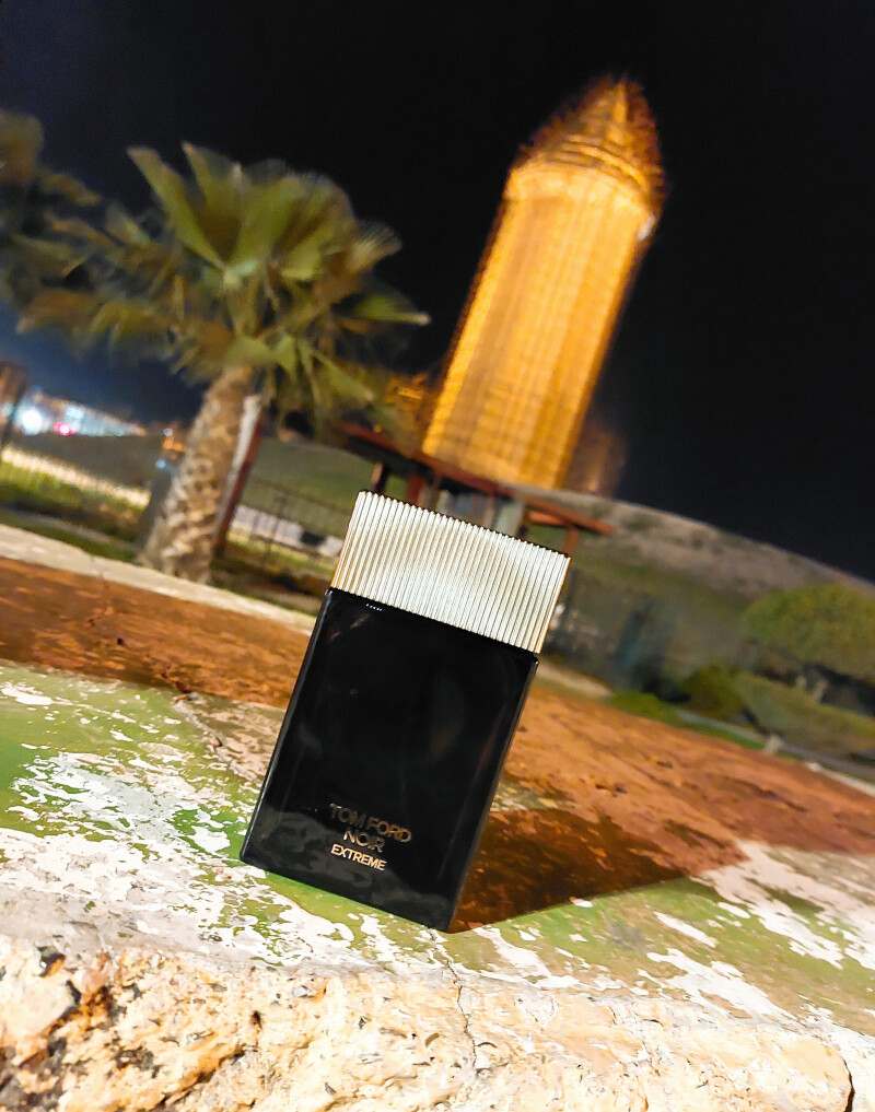 Tom Ford Noir Extreme and Qaboos brick tower in one frame.